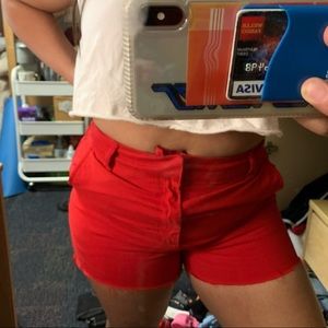 Red distressed shorts